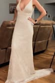 I wanted to review this dress since their aren't many good pictures of it. This is a beautiful dress!  It's heavy but feels nice on. I need to have the straps taken up maybe 1-2 inches and then the V is where it should be in the front and back. The train is long and heavy and doesn't drag well. It rolls up. I'll have that trimmed off as well. - Nichole G.