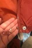 Well, besides the fact it runs small, it quite literally disintegrated in my hands when I tried to use the zipper for the third time. Lovely. - Liz S.