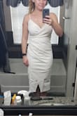 Cute dress, not too long for me even though I'm short. It doesn't lay quite as smooth as the pictures due to the material. I probably could have gone down a size to have it be tighter, but I think the medium works better. Definitely a little low cut for the bustier girls. - Megan C.