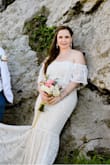 I thought this dress was going to be too big when I first put it on but was I pleasantly surprised!! Fit like a glove. The best fitting dress I have tried on. Perfect for a beachside wedding. This dress was perfect in every way. I am usually a medium and it is true to size. The only downside to it is the bottom of the dress has no stretch in the seam. Other than that I LOVED IT!! - Michelle M.