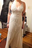 I ended up not using this dress for my wedding dress. My friends liked it on me and thought it was really pretty, but I ended up going with a different dress from Lulus. I like the beadwork on this dress but what I didn't like about it was that it felt really heavy and kind of stiff to move in and it wasn't true white but almost an antique white which I think makes it look dirty. I think each girl has a dress they love and look good in and I just don't think this dress was for me but it was still gorgeous! - Audra V.