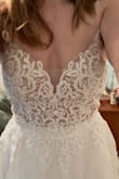 This dress is so beautiful and bridal.
I originally ordered it in a 6 because that's what size fit in other dresses but it wouldn't even come close to zipping so I ordered in an 8 and it fits but that's just about it. Time to hit the gym so I can fit more comfortably in this dress! - Ashley P.