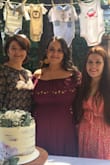 I love this dress!! I went down a size because of reviews. The style of the dress is very loose, it is not unwearable but it would look better if it was a bit tighter in the top area. I used it for my baby shower 7 months pregnant and it still was a little large. - Ana E.