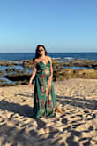 I felt beautiful in this dress. I was between sizes and ended up keeping the small because the medium was back-ordered. Medium would have been better. The dress was great quality and color vibrant. - Ziomara A.