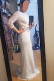 This dress fits well and is pretty comfortable, but I just didn't think it was high quality enough to be my wedding dress. Also, for me, the bright white color wasn't a good fit. (Note: the lace looks weird in the back because I didn't notice one of the scallops was folded under.) - Emily C.