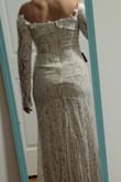 Was hopeful that this dress would win me over as I am a bride on a budget. I like parts of it but am not in love so the hunt continues. Initially bought a med but it was tight around my arms so couldn't close, the sleeves were already too long but I figured if anything they could be shortened. The large fit better but as you can see, the arms were very long and I just wasn't in love with it. The fabric, the way it sat on my body... could work better for a less curvy/busty gal or at least taller. Definitely worth a try at the price point t though! And Lulus is very good about returns. - JUDITH E.