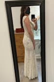 This dress is even more beautiful in person.  The fit is exactly as expected and is very comfortable.  I would highly recommend this dress! - Rachel G.