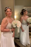 I ordered 7 gowns from online and tried on 9 in stores. And this gown was perfect for our Las Vegas wedding in December.  It was stunning but had to get it tailored down which was more than the dress cost .  I added the custom cape .  I got so many compliments on the dress.  I'm 54 years old , 1st marriage. I will be tailoring the dress again to the knee to used a cocktail dress in the future. - Kelly V.