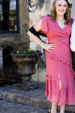 I'm so happy with this! I got this dress for my partners siblings wedding! It is exactly what I wanted but the slit was quite high for my liking. I took it to a tailor and got the top layer hemmed. - Shelby W.