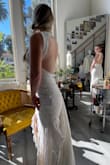 This dress is really amazing and looks like a much more expensive dress than it is. I had a talented dressmaker help make a few adjustments; adding padded bra cups and tacking the lining to the lace as well as adding a bustle clip. Perfect for my body type and our small destination-style wedding!! It travels well and doesn't wrinkle. Love it and am so happy I didn't spend a fortune! - Bridget E.