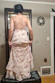 I got an XS despite technically being an S, and it fits perfectly - I think I wouldn't even have had to hem it. I'm so short that my bridesmaids made me stand on a stool, haha. I got it as part of a big order to choose one wedding dress, and it didn't make the cut but was lovely regardless! The color in the pictures is cream, but the color in real life is more like light pink. - Esther C.