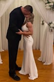 Wanted a simple fitted wedding dress for our elopement. A little long on me. I am a competitive bodybuilder 4'11 106lbs. My husband is 6'6 hence why it may look small. - Montanna R.