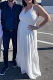 This dress was perfect for our courthouse wedding! It is definitely long. I am 5'11.5" and always have problems with dresses being too short and this dress touches the floor in flats. It's not often I find a dress I can wear with heels! - Meagan M.