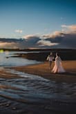 This dress was perfect for engagement photos. It was flowy, elegant, and sexy, but covered up my arms which I'm more sensitive about. - Liesel R.