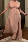 I originally ordered the large at the suggestion of the size calculating tool and found the top to be rather loose and unflattering. The medium fit just right. I would suggest ordering this dress based on your waist measurement as opposed to your bust or hips. - Mary J.