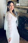 Loves this dress. Great quality and beautiful details. I thought the arms would be more form fitting but they were a looser fit. Also was pretty long even with heels. I would have gone a size down and probably hemmed the bottom for length reasons. - Magda C.