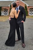 I felt amazing in this dress! So many compliments! The v neck still kept everything covered, not too revealing like you may think. I never had to adjust anything. I did have to hem the bottom even though I wore heels. It is very form-fitting, but I love it and hope you do too! - Meryl B.