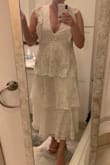 This dress is so beautiful! The color was true to the photos, more of an ivory. I normally wear a medium or large and the medium fit great! I bought this to wear to a wedding event and absolutely will look great at my shower or rehearsal! I'm 5'9" and it hits a little above my ankles perfectly for a cute cropped look, but not quite as short as a midi dress. I also love the deep v neck, very flattering! It is a little sheer, but nude undergarments work just fine. There's a nice lining too so it's not itchy at all. So cute! - Abbey M.