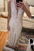 I bought this to wear for my reception since my long sleeve wedding dress is a little hard to dance in. I can't believe the quality for the price. If I didn't already have my expensive gown I would have just worn this the whole wedding and saved a lot of money. I had to have it hemmed as expected and I added cups since the bust was a little big on me. Otherwise, it fits perfectly. - Jennifer D.