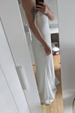 I ordered this dress for my wedding and I was not disappointed! It's of great quality and the sizing was great! I'm usually a large but ordered an XL as I wanted to be able to get it altered to my shape closer to the wedding. The material is not super see-through but I'll have still have to be mindful of my undergarments in this dress!
It's long enough! I'm 5'9" almost 5'10" and it's perfect! - Carlie K.