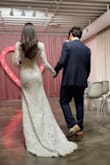 I normally wear a XS in al lulus dresses. This one happened to run large in the arms and waist but most wedding dresses must be fitted anyways so that wasn't a problem. I took it to my tailor and had the shoulders, arms and waist altered to my measurements . Got many compliments on it. - Lacy G.