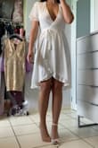 I'm an ex swimmer so I have trouble finding medium size clothing that will not feel tight on my back. This one, although it feels firm when I bend over, it is not uncomfortable at all. It's a wrap dress which means there is room for adjustment but this dress is beautiful. I totally recommend this. Also paired it with some shoes I also got from Lulus - Isabel R.