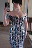First of all, let me just say - I LOVE this dress. It's even more beautiful in person. When I first put it on, I said "WOW". I knew then that this is going to be my wedding dress!

As for size, trust your usual dress size. I usually wear a size S, even after gaining 10lb during COVID. I was recommended a size M by TrueFit. I first ordered M (photo with looser waist). I loved it even there, but then decided to give size S a try. See the fantastic difference!! Suddenly, I have the true hourglass shape and my boobs are plump and sexy. I am wearing the dress with nipple covers, no bra. This dress is flattering for someone with big hips (like me!) and a small chest. The length is adequate too -- the dress is just touching the floor (in both S and M).

There can be some awkwardness with the adhesive lining along the chest turning inside out, but not very noticeable. Arm cuffs comfortably snug in both sizes. Hugs my butt perfectly. I recommend trying on 2 sizes (free returns!) and DEFINITELY recommend the dress!! - Kateryna C.