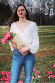 This crop top is super cute and soft. The sleeves never slipped off my shoulders either! - Emily C.