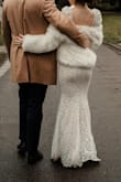 I was so nervous to order my wedding dress online, but this one fits like a glove. It feels super soft and stretchy, I loved the way my body looked in it. Everyone was astonished that I ordered it online!
Because our wedding day was rainy and we walked through the park, the hem of the dress got super dirty, but that kind of added a super vintagy-ombre touch to it (also, it all washed off afterwards).
If you order this dress from Germany/Europe in general, be aware that you will probably have to pay extra for customs, I think I payed another 40¬ or so. Still, well worth it! - Emilie G.