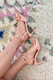 These shoes are gorgeous! The color is the perfect satin pink, the only problem is they run large. I usually wear a 7.5 or 8 and I had to return them for a 7, which are still a little big but I can make them work. The biggest problem with these shoes is the straps. The back strap that should hug your heel is enormous, while the ankle straps that buckle are tight on the 7's and were enormous as well on the 7.5's. I had to weave the back strap through the tight ankle strap so they stay on. For reference, I'm a size 6 and my ankles are relatively small. 
The price is so inexpensive and they are beautiful, I would return but these are for my wedding in a few weeks and I've run out of time, plus I'll only be wearing them for a few hours and with some savvy adjustments I can make them work. Photo 1 shows the enormous back strap, Photo 2 shows how I wove the ankle straps through to make them work. I hope they work for you, they really are lovely shoes! - Stefanie C.