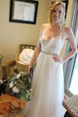 I was skeptical about this dress at first, when I opened the bag and saw the boob pads I got scared that they would be super visible and look ridiculous. I was pleasantly surprised when I tried it on! It's possible it is because I am so pale but you couldn't see the boob pads at all and the bodice is so beautifully detailed. The fit was great, I got a size 6, and it fit perfectly! I added a rhinestone belt and I really think it pulled the look together. I had a tight budget and this dress doesn't show that, I think it looks way more expensive than it actually is. Overall I would highly recommend this dress!!! - Roxanne D.