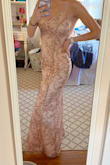 Was definitely anxious ordering this dress because of a couple bad reviews I read but it is everything I hoped for and more! I usually wear a S and ordered an XS and it fits perfectly like a glove! Not too tight not too loose and hugs all the right places. I do have no hips so I'm not sure how it would fit on someone with wider hips. The material is very nice, the slit is in the perfect spot, and the top has enough space. The color and gold decor SPARKLE beautifully in the sun! And the straps are adjustable and very comfortable! If this dress restocks get it!! Wearing it to my senior prom in a couple months and couldn't be more excited - Grace G.