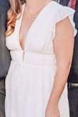 This dress caught my eye while looking for my small/casual-ish courthouse wedding. The model's body type is nothing like mine but the reviews were extremely helpful. It was a bit long, but 2-inch heels made it almost perfect. It was big in the chest, but nothing fashion tape couldn't fix. I felt so comfortable, confident, and beautiful (and a tad sexy) in this dress. It hid all my insecurities. - Melissa A.
