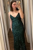 It's so pretty. it fits well and the back I'd gorgeous. the only problem is that I have to get the end of the dress hemmed because it's a little long on me. other than that, beautiful dress. - Madeline R.