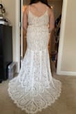 This dress has a beautiful train, but the front was longer than I expected (as a short person, I would have needed very tall heels and some strategic tailoring to make sure I wouldn't trip). I tried on various Lulus dresses for my wedding and this one just wasn't the one I felt prettiest in, so I wanted to share photos to help others who may have similar body shapes! In general though it is a beautiful dress. - Vanessa F.