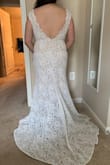 This dress has a beautiful train and a nice and comfortable design. I personally think you could dress it up a lot more with some accessorizing, or even getting some beadwork added to make it stand out more as a wedding dress. I wasn't able to zip up the last 2 inches or so, but I wouldn't have wanted to go up a size because then it would probably look too big on me and require more tailoring. I would have needed to add some kind of corset lacing to close it all the way, and also take off a few inches because the dress was too long for me. I ended up choosing a different Lulus dress that was more flattering for my body and didn't need any tailoring! - Vanessa F.