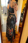 I love this outfit! The size I bought fit well. Not stretchy but everything is tied together so it should be somewhat flexible in how it fits different body types. Definitely need someone to help you tie the top on. I have a short waist and long legs so not much midriff shows and the skirt just barely grazes the floor without shoes. With a slight heel it should be perfect. - Janaki N.