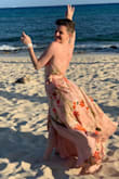 This dress will make you feel like royalty! The skirt billows just right, the fabric is sooo soft and luxurious, and the pattern and colors are absolutely gorgeous! Plus the shape is super flattering. I had to get a few inches taken off, especially because I wanted to go barefoot for a beach wedding, but it worked out great because we used the spare fabric to accent my partner's hat. We got so many compliments and I felt so fancy all day. I'm wearing it again to a Bridgerton Ball experience in April! <3 - Moxy W.