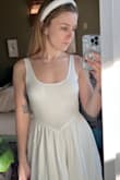 I really like this dress, the waistline is different and really flattering. The skirt is fuller than I realized but I really like it. It makes me feel like I'm in a Disney fairytale haha. It's a little snug but not enough to make my size up. The top is see-through but if you wear a hidden bra, it should be fine. I put in bathing suit cups just to get an idea and you can barely see them. Definitely recommend this dress! - Alexa W.