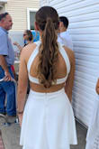 I wore this dress to my outdoor engagement party and received so many compliments. It's fun and flirty with the open back but also classy with the mock neck. Worked great with an up-do for the heat of summer! - Anna M.