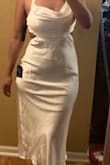 FOR STARTERS LOVE THE DRESS BUT THE SEWING ON THE BUTT IS SO BUMPY. THE LINING OF THE BACK IS SCRUNCHED UP WHICH I DID NOTICE BEFORE BUYING BUT ON THE BODY IS MAKES YOU LOOK MORE BOXY THAN FLATTERING THE CURVES. THE BUILT IN BRA IS GORG BUT THE STRAPS ARE VERY LOOSE NO MATTER HOW TIGHT YOU TIE SO IT DOES NO LIFTING FOR THE BREASTS. MAYBE I COULD CHANGE IT FOR AN XS BUT IM STILL CONTEMPLATING KEEPING OR RETURNING. - Kayla M.