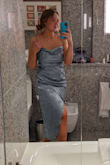 This is not a dress I would have normally chosen but I'm so glad I did! I wore it for my master's graduation and I felt so confident, classy, and beautiful. I would have normally ordered a large, but because of the other reviews saying it ran large, I sized down and the medium fit me perfectly! Definitely order a size down if you're unsure or in between sizes. I have a bit of a belly and a muffin top, but I wore my Spanx and the dress hugged my curves in all the right places. The fabric is gorgeous under lights and is such a great fit for so many occasions. Wearing it again to my boyfriend's graduation next week! 10/10 would recommend this dress, and order a size down! - Delaney W.