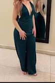 This jumpsuit is everything. It fit perfectly but it was long, even with heels so I had it cut to the perfect length. Other than that it was absolutely perfect. I loved the front and the backless design. - Kayla D.
