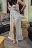 This is going to be my dress for my wedding! (well.. not this one, I'm going to have to exchange it for a size bigger) but I knew when I ordered it that it would be a little tight. Considering price, and the way it's constructed it makes sense that it would be hard to let it out any. The lace is lovely, soft, and just the right combination of fancy and rustic for our country wedding. The 'nakedness' isn't quite my style, so I will have some kind of skirt added underneath - But I'm so excited to find something that is the right style (and cost) for me! - Joanna B.
