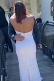 This dress made for a perfect fit for my wedding day! I got the back altered slightly for a low- V instead of a straight back to make more room for the bust. The dress fit perfectly, but I need more room for my chest to fit in comfortably. This dress is lightweight and looks GREAT in photos. Great for a simple ceremony! - Natale T.