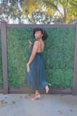 This dress was very flattering, and the color looked amazing. The dress was a little fitted on the top portion however I do have a wider back than normal. However, I still wouldn't change the size. I definitely recommend it, it was so beautiful and I received so many compliments. - XIOMARA H.