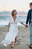 This was the perfect dress for my casual beach wedding ceremony! Being only 5' tall, I assumed it would be a bit long, which it was. I was able to self-shrink the dress by washing/drying in the dryer. Only the outer layer shrunk and I had to have the inner layer hemmed, but still way more cost-effective than a full alteration! I would definitely recommend this dress! - Lynsey B.