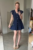 I was so pleasantly surprised by this dress. I love it. I would say it's a more casual dress, material is nice, light-weight. Will be good for spring and summer. I'm usually in between S and M- for this I definitely needed a M. The dress itself comes in at the waist, plus the tie belt gives you a nice defined waist. - Jessica D.