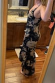 This dress comes off a little more scandy than it seemed in pictures before I bought it. I would have had to have the top "brought in" even though I have a medium bust size. It was way too tight for me to feel comfortable in around my hips and thighs, though. I could order up if you're right in between unless you want it skin tight. Beautiful print. Sad it didn't work out. - Kelly G.