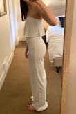 I bought this for my rehearsal dinner as a bride, but I ended up returning it because the bust was too loose and slipped down when I moved, while the stomach was too tight and unflattering (always had creases that drew attention to that area). I don't have big curves, so if you have an athletic build like me this might not work on you. - Morgan H.
